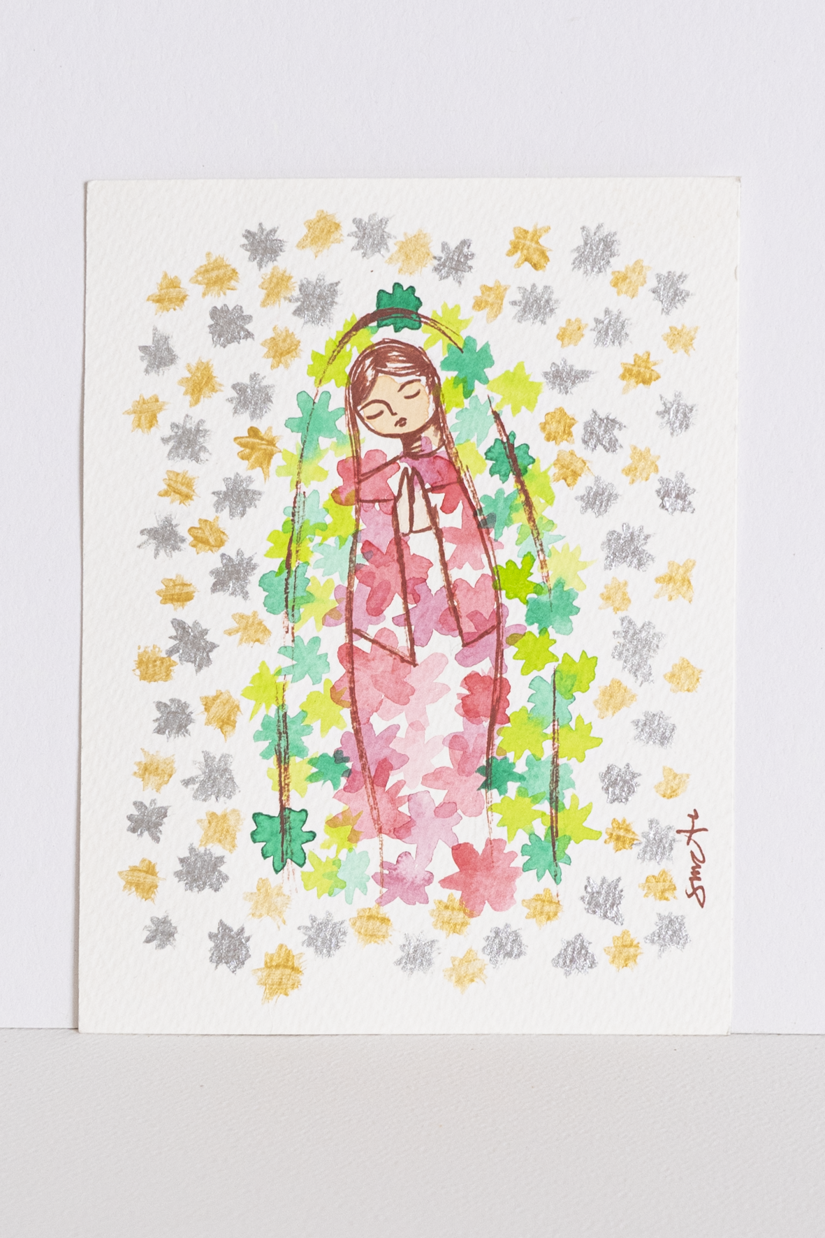 Virgencita Gpe con flores